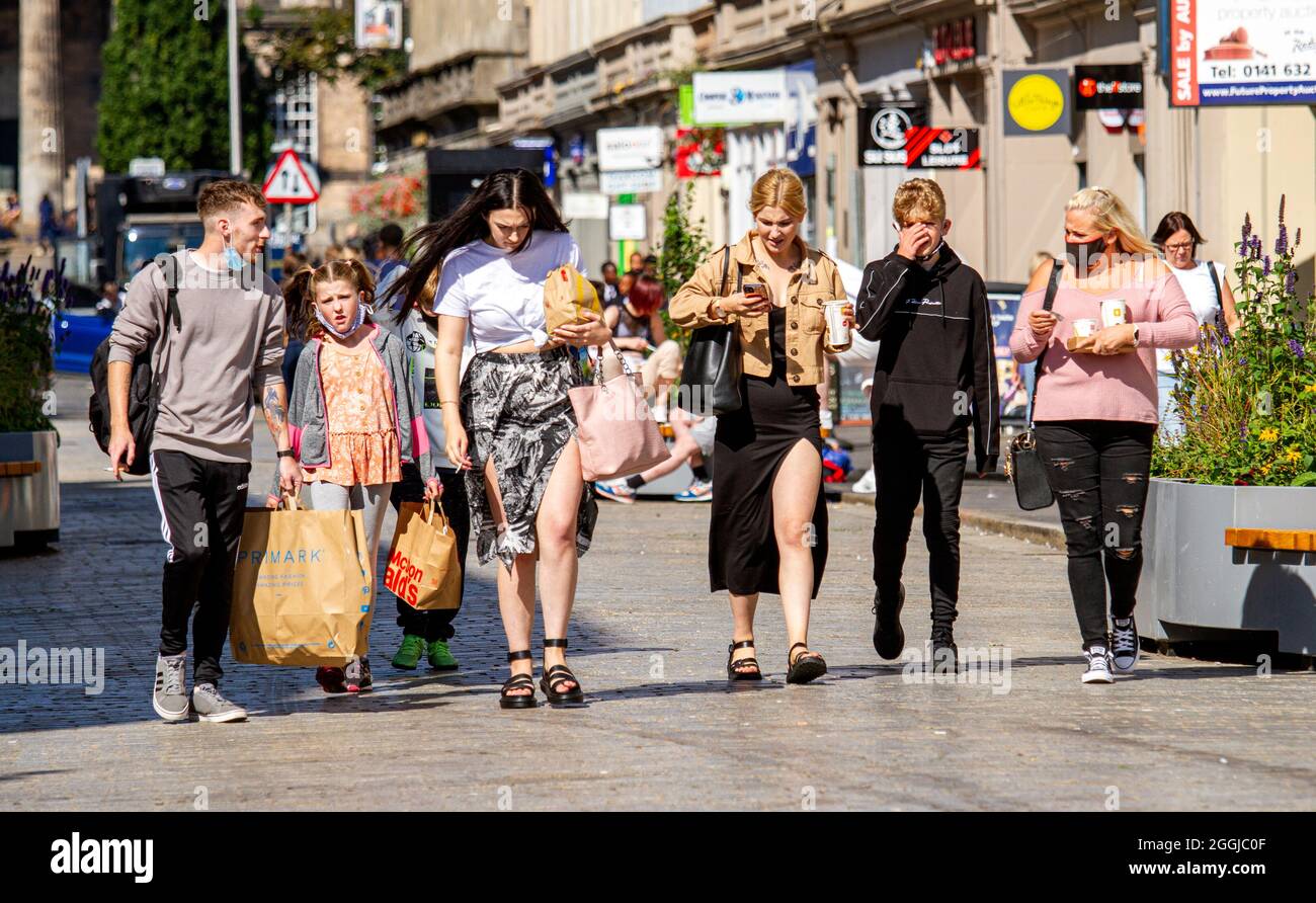 Dundee, Tayside, Scotland, UK. 1st Sep, 2021. UK weather: A very warm and sunny day across North East Scotland with temperatures reaching 20°C. Local residents enjoying the day outdoors after months of Coronavirus lockdowns. A group of people walking together enjoying the hot weather carrying McDonald`s happy meals during a day out shopping in Dundee city centre. Credit: Dundee Photographics/Alamy Live News Stock Photo